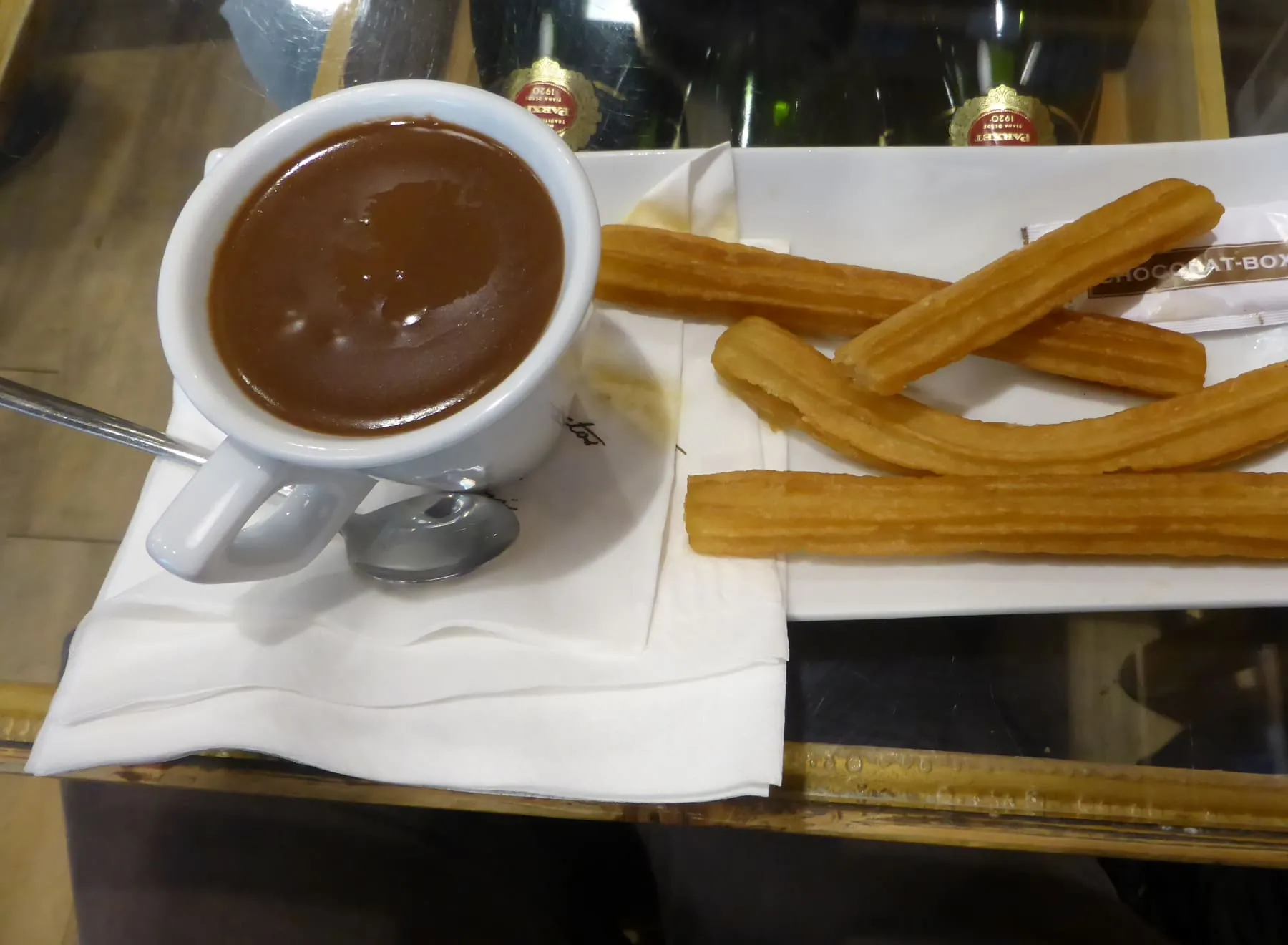 Churros with a cup of thick hot chocolate